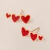 Les Boucles D'oreilles Clarisse 3 Cœurs Rouges - Dorées à L'or Fin 24 Carats