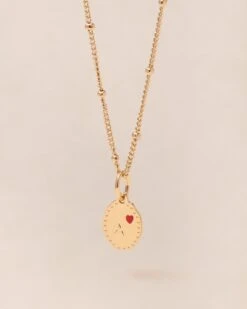 La Médaille Initiale Manoa - Rouge Et Dorée à L'or Fin 24 Carats - 10mm 22 La Médaille Initiale Manoa - Rouge Et Dorée à L'or Fin 24 Carats - 10mm -Bijoux Magasin PERMANENTS BIJOUXROUGES MedailleinitialeManoa10mmA emoiemoi 951web